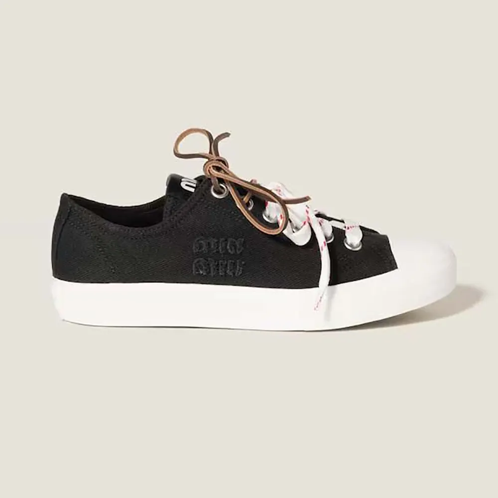 Side profile of Miu Miu Women Washed Denim Sneakers-Black showing silhouette