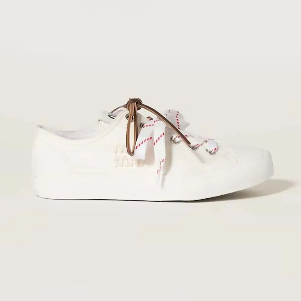 Side profile of Miu Miu Women Washed Denim Sneakers-White showing lace-up detail