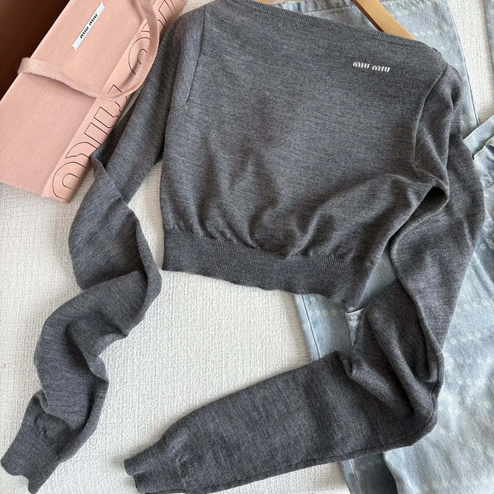 Side angle showing boat neckline of Miu Miu Women Wool Boat-neck Sweater