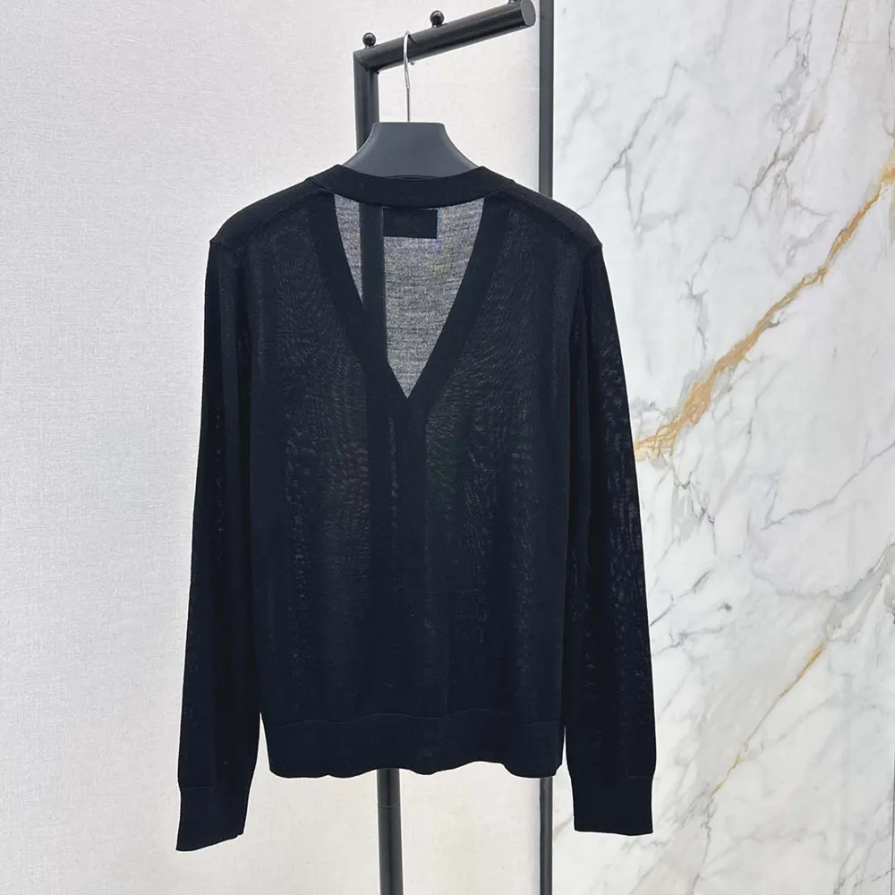 Side angle of Prada Women Cashmere Cardigan-Black highlighting sleek fit
