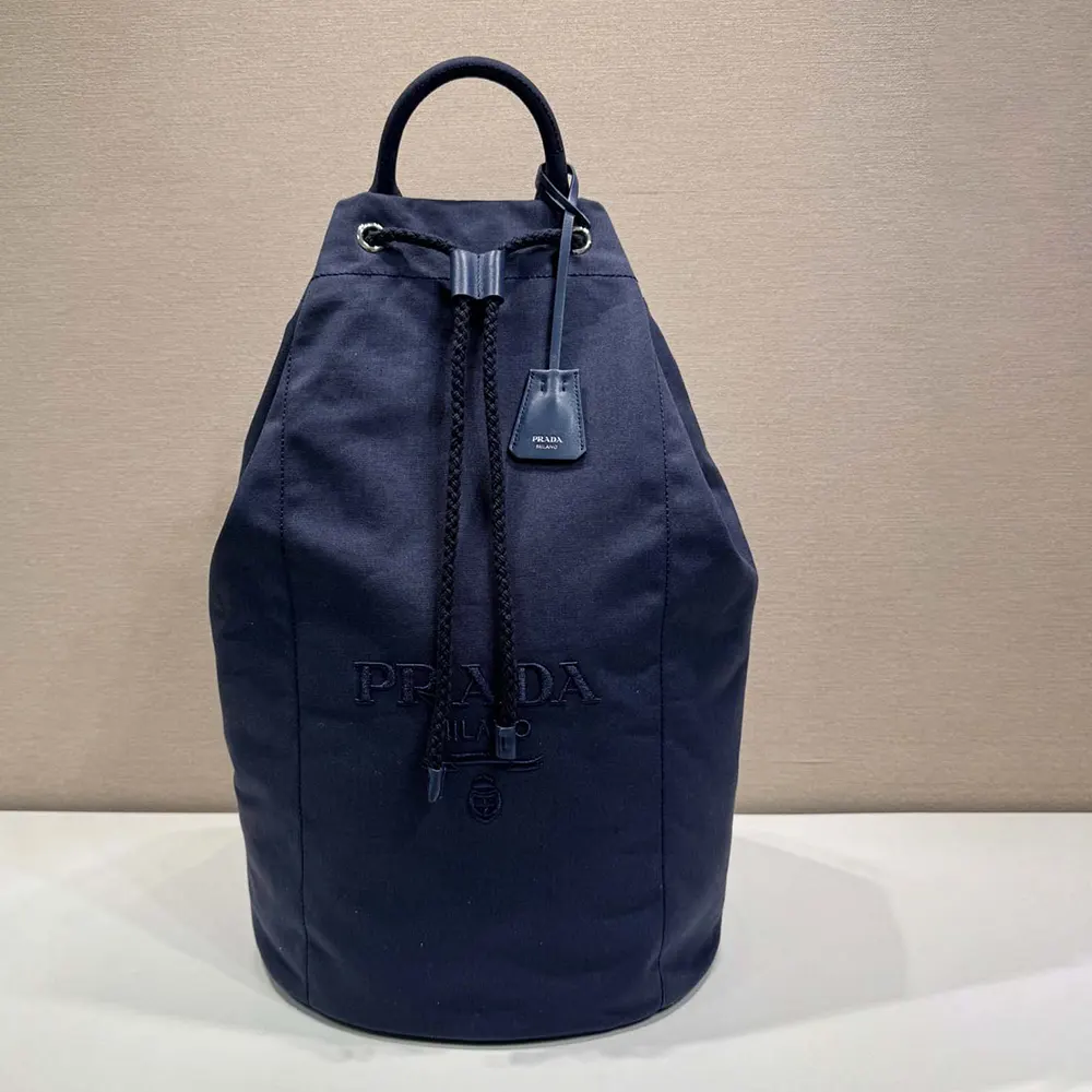 Side angle showcasing silver hardware on Prada Unisex Canvas Drawstring Duffle Bag