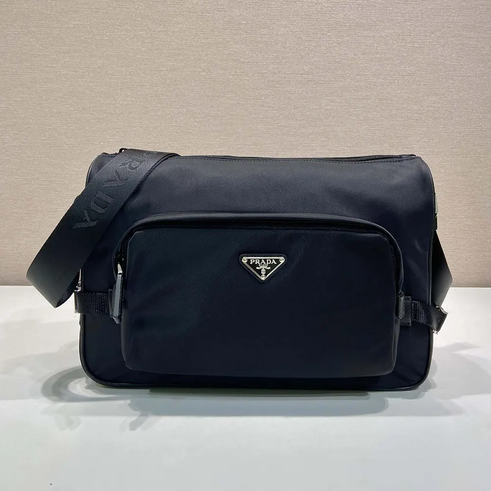 Close-up on silver Prada logo hardware on Re-Nylon and leather bag