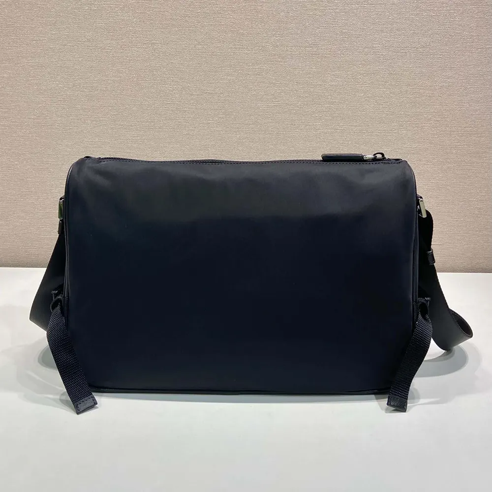 Side angle showing zipper and adjustable strap on Prada shoulder bag