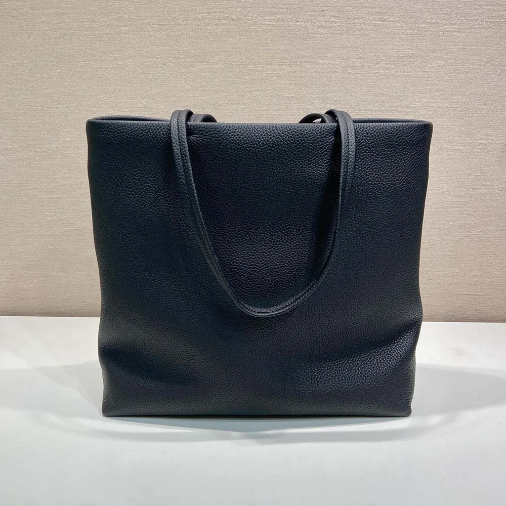 Side angle showing spacious interior of Prada Unisex Leather Tote-Black