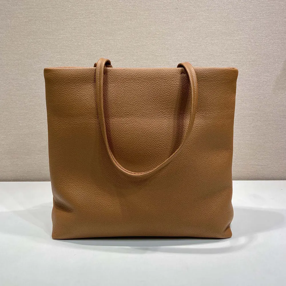 Side angle showing spacious interior of Prada Unisex Leather Tote-Brown