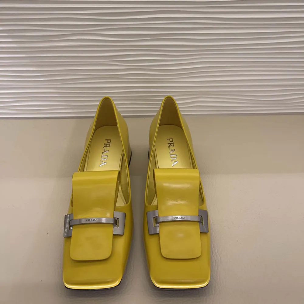 Close-up of brushed leather texture on Prada Women Brushed Leather Pumps-Yellow