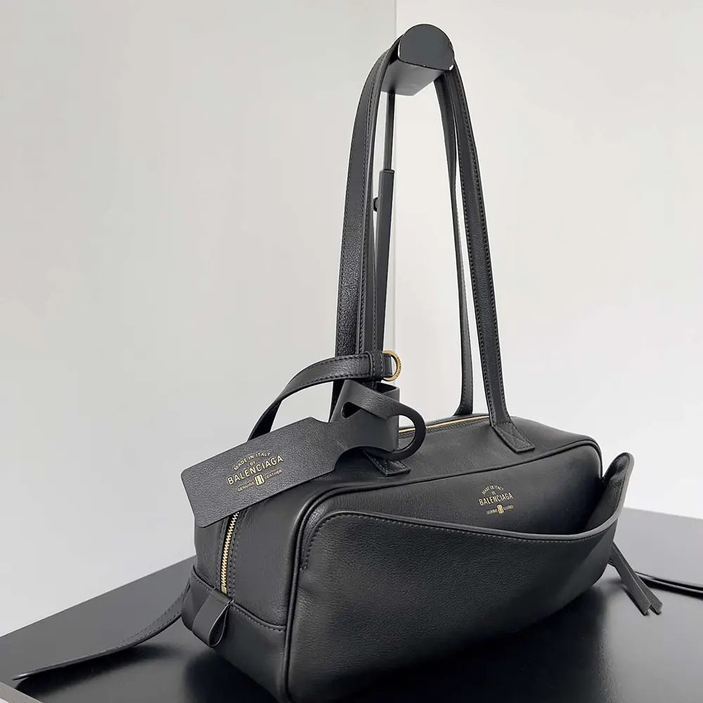 Side angle showing silhouette of Prada Women Carrie Bowling Bag Small