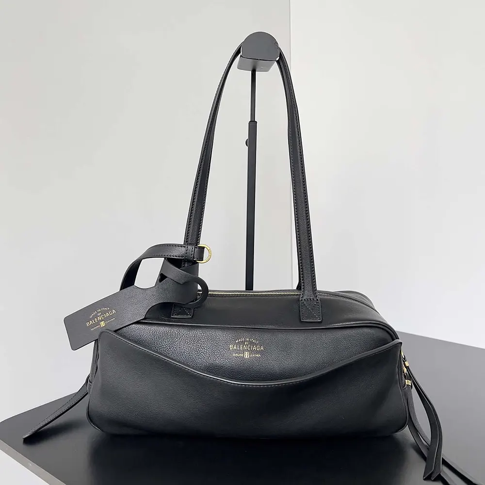 Close-up of silver Prada logo and zipper on Carrie Bowling Bag Small
