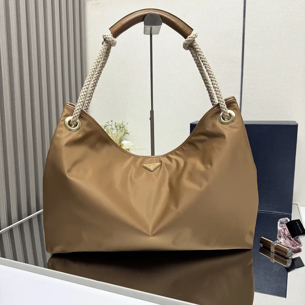 Close-up of silver-tone hardware on Prada Women Mariner Large Re-Nylon Shoulder Bag-Brown