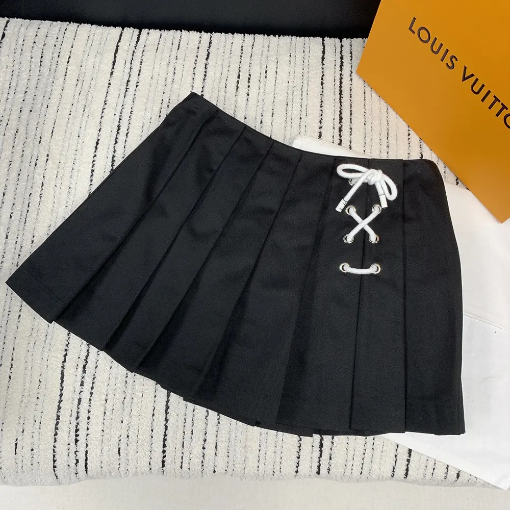 Close-up on pleated detail and fabric texture of Prada Women Pleated Stretch Drill Miniskirt
