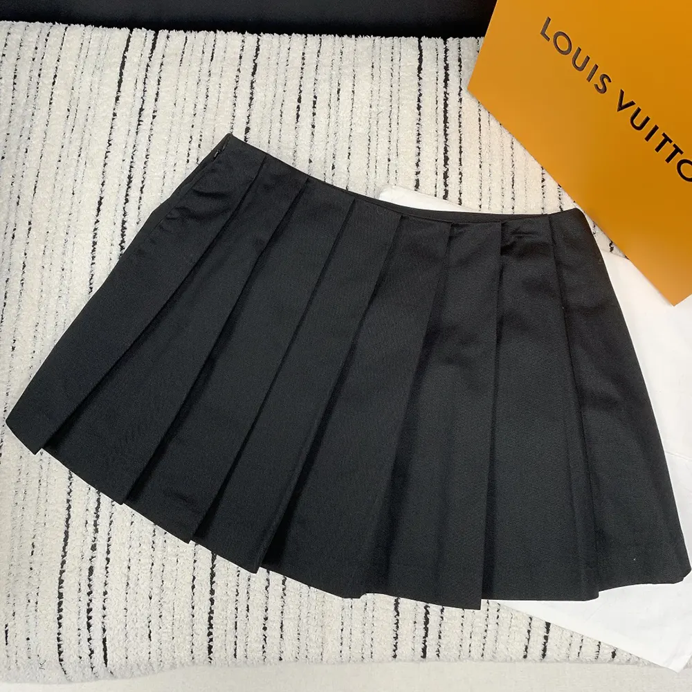 Back angle showing silhouette and signature hardware on Prada Women Pleated Stretch Drill Miniskirt