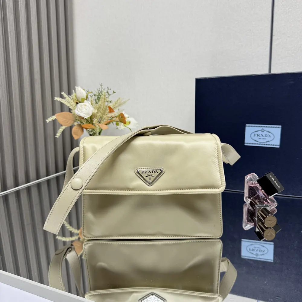 Side angle showing padded texture of Prada Women Small Padded Re-Nylon Shoulder Bag-Beige