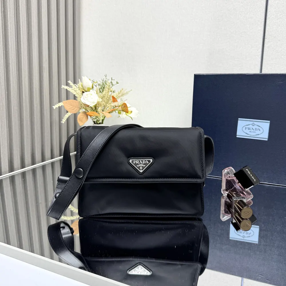 Side view showing the padded silhouette of Prada Women Small Padded Re-Nylon Shoulder Bag-Black