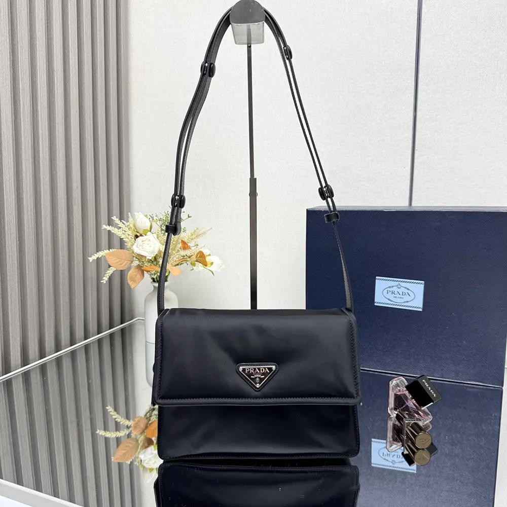 Close-up of Prada logo plaque and silver hardware details