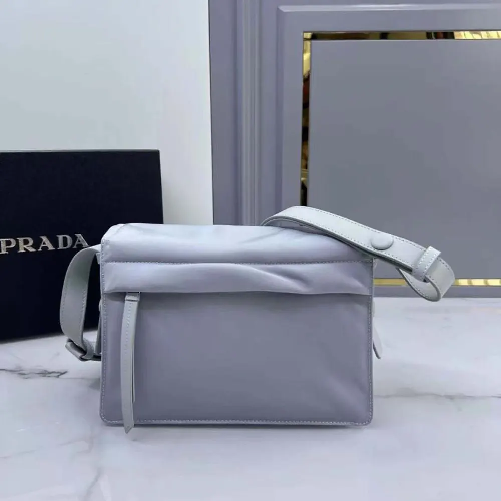 Side profile showing padded texture on Prada Women Small Padded Re-Nylon Shoulder Bag-Blue