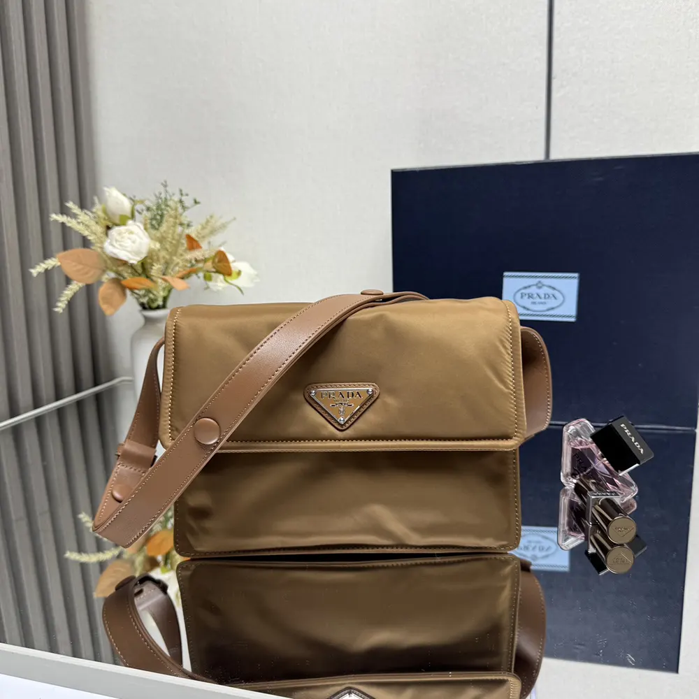 Side angle showing padded texture of Prada Women Small Padded Re-Nylon Shoulder Bag-Brown