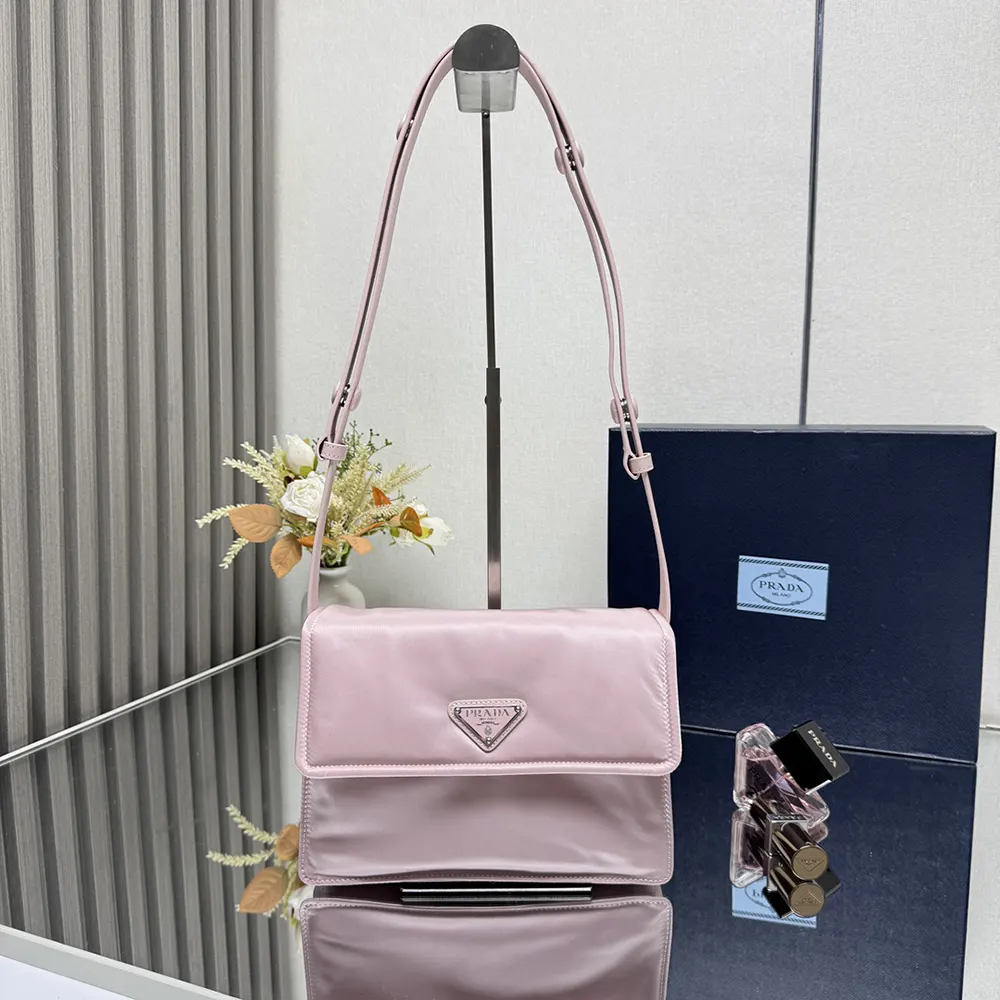 Close-up on pink padded nylon and silver-tone closure detail