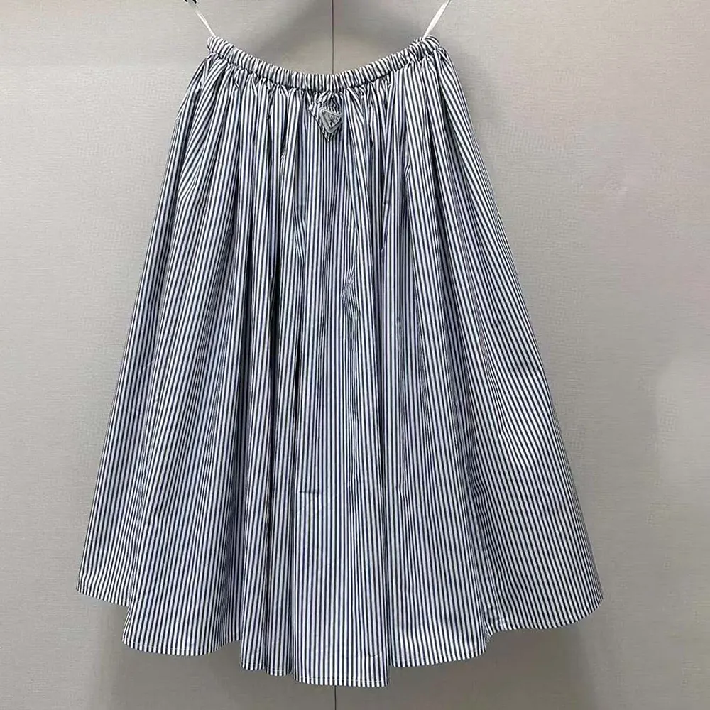 Close-up of button and fabric detail on Prada Women Striped Poplin Skirt