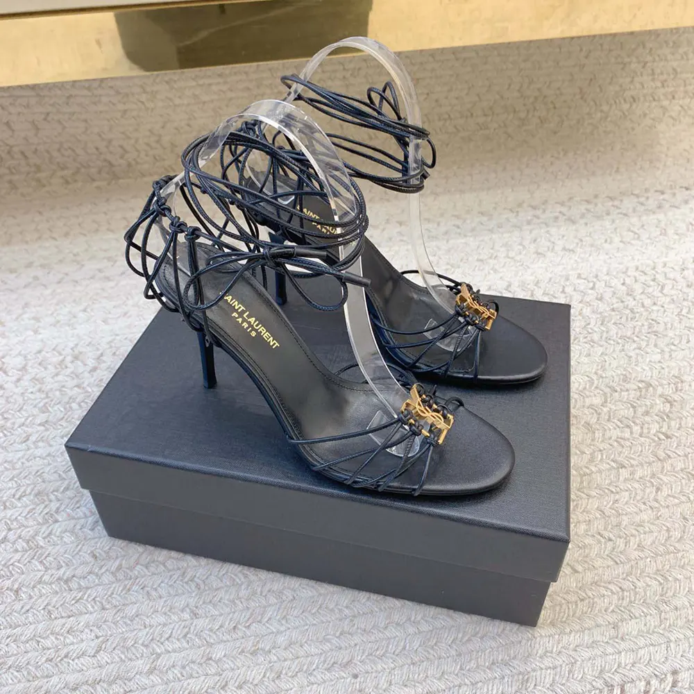 Overhead shot showing ankle strap and high heel of Saint Laurent Babylone Sandals