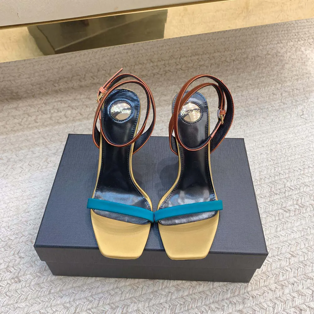 Close-up of gold YSL hardware on Saint Laurent YSL Women Dominique Sandals