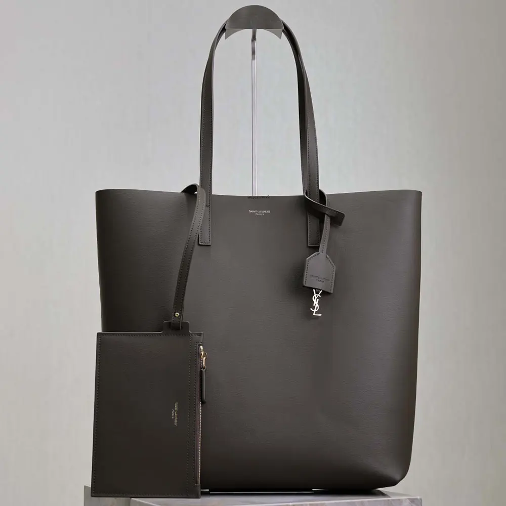 Close-up of gold YSL hardware on Saint Laurent YSL Women Shopping Saint Laurent in Leather-Gray