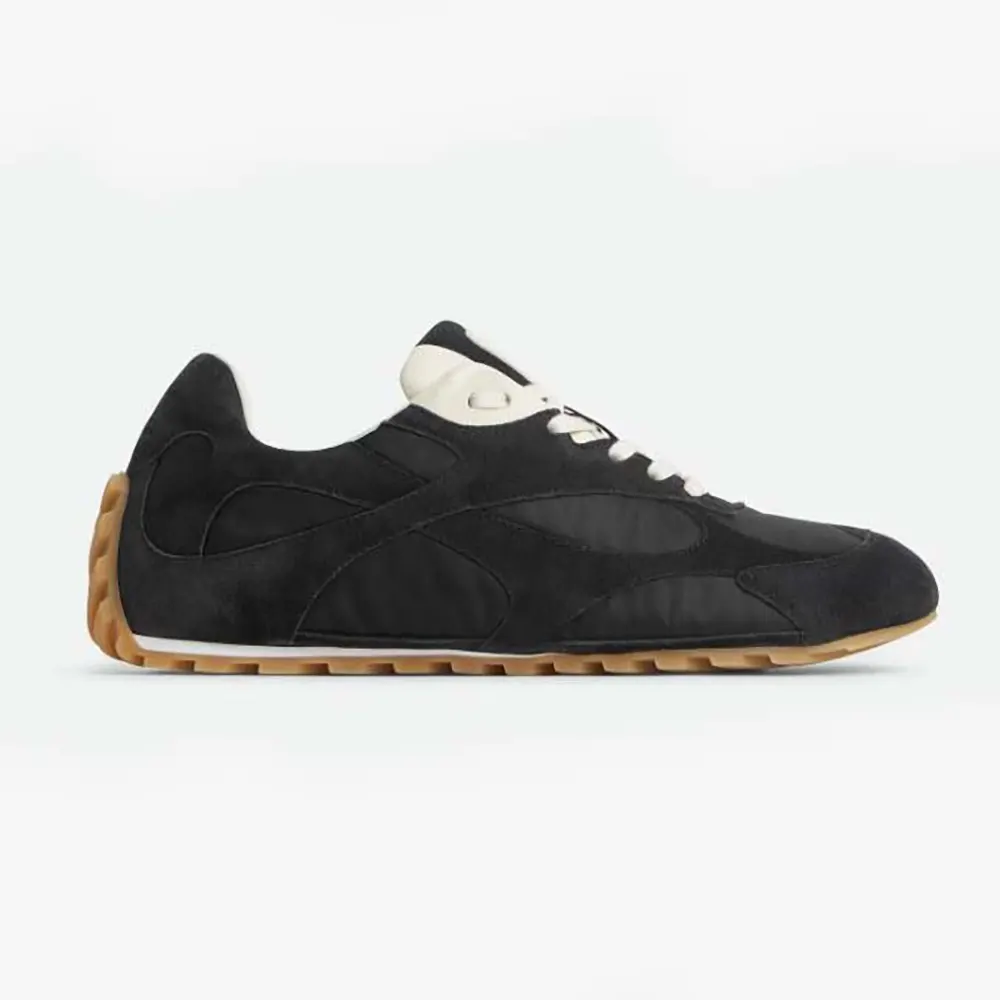 Side view of Bottega Veneta Unisex Orbit Flash Sneaker-Black showing woven detail