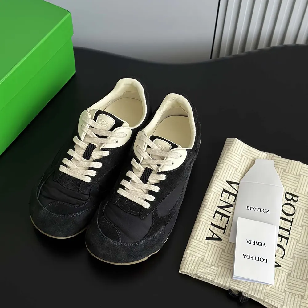 Close-up of black leather intrecciato weave on Bottega Veneta Orbit Flash Sneaker