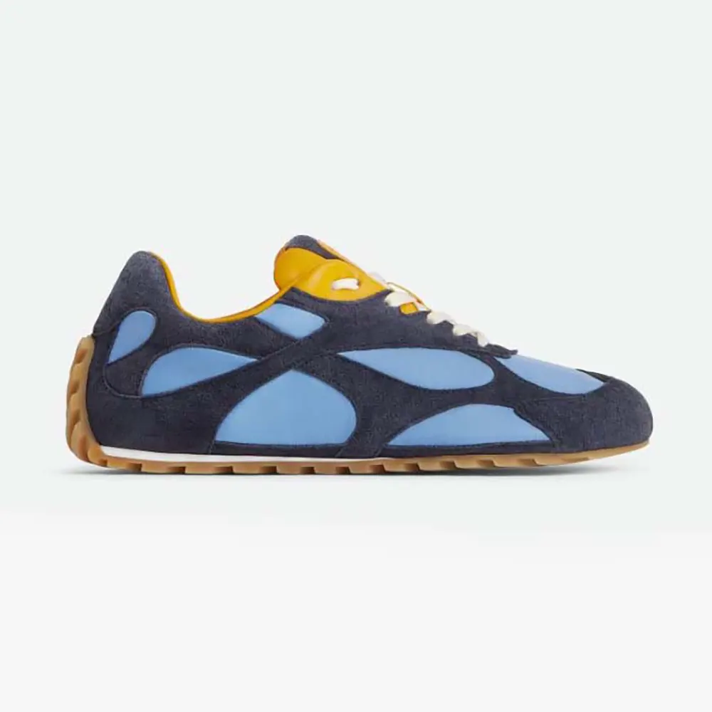 Side angle of Bottega Veneta Unisex Orbit Flash Sneaker-Blue showing woven detail