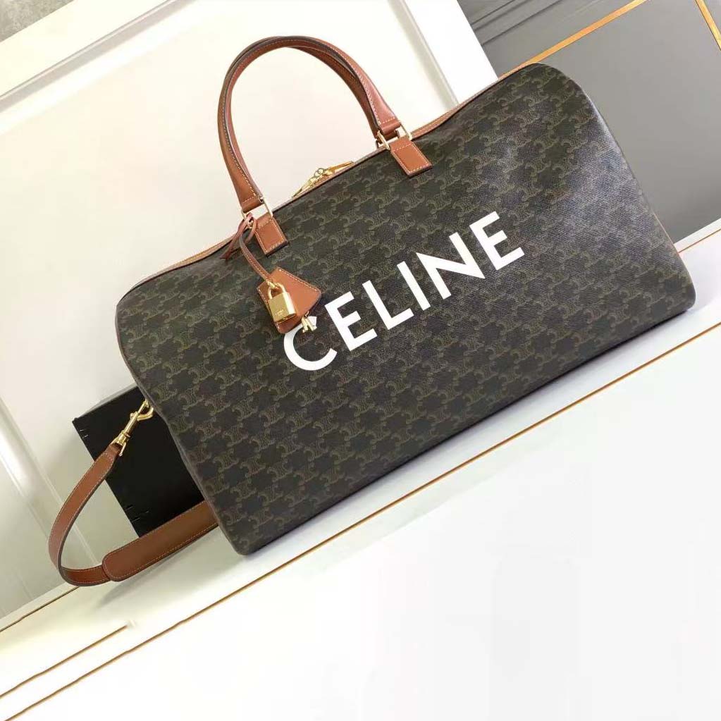 Side angle showing size and adjustable strap of Celine travel bag
