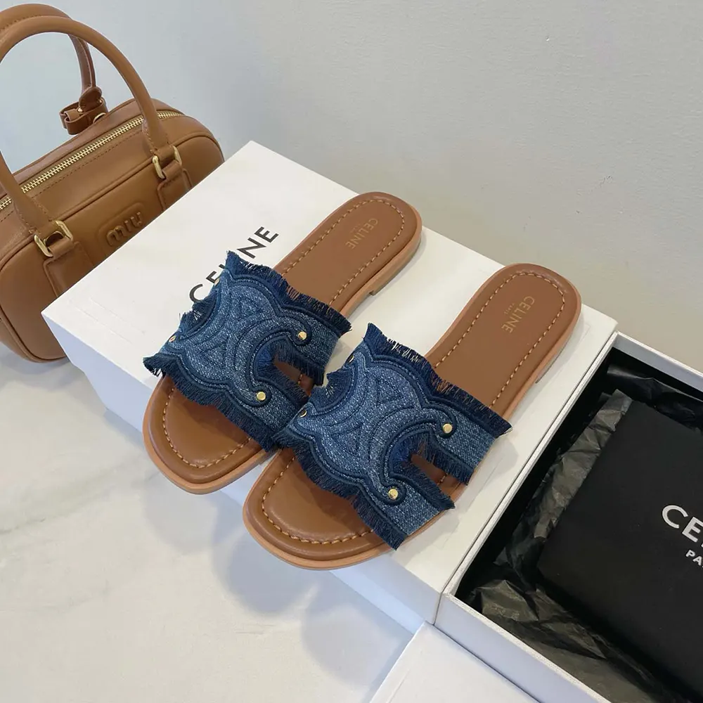 Overhead shot showing navy denim and gold hardware mule