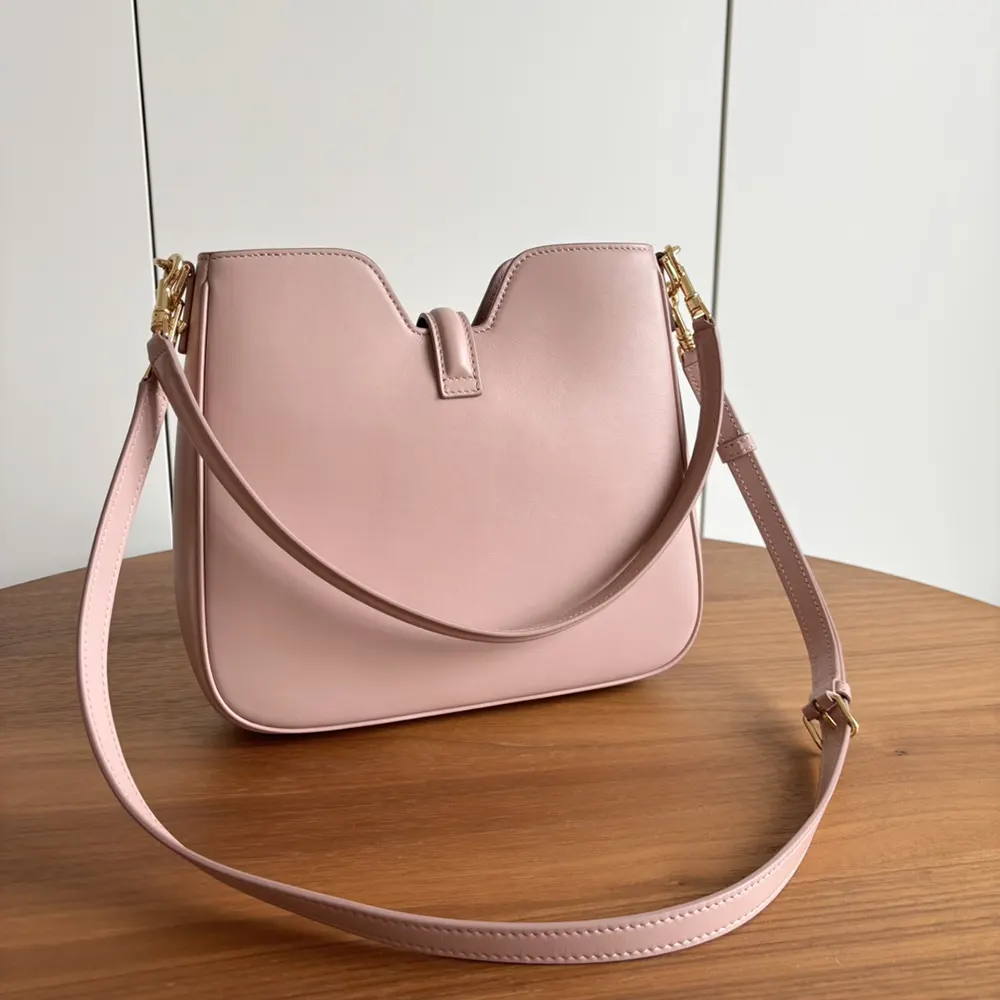 Side angle showcasing silhouette of Celine Women Small Camille 16 Soft Bag