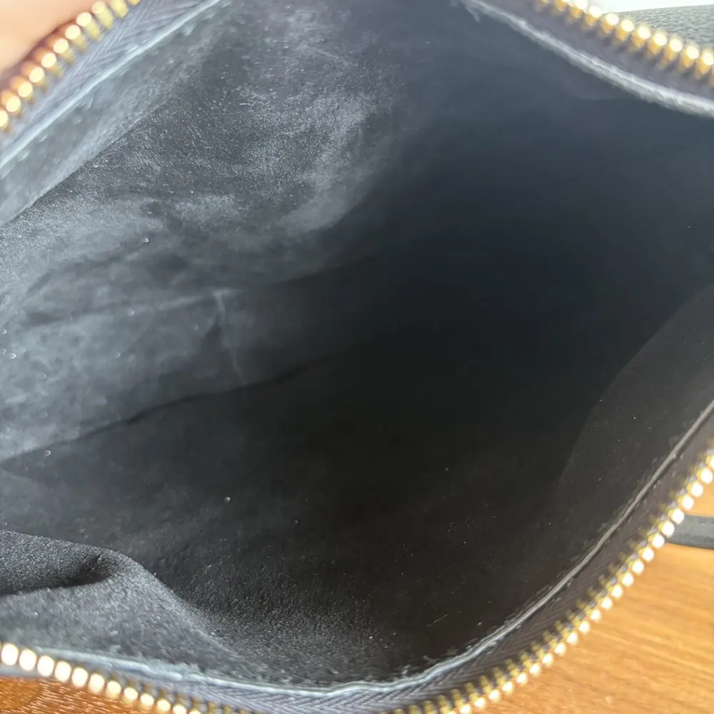 Close-up of signature gold hardware on Celine Women Teen Celine Llulu