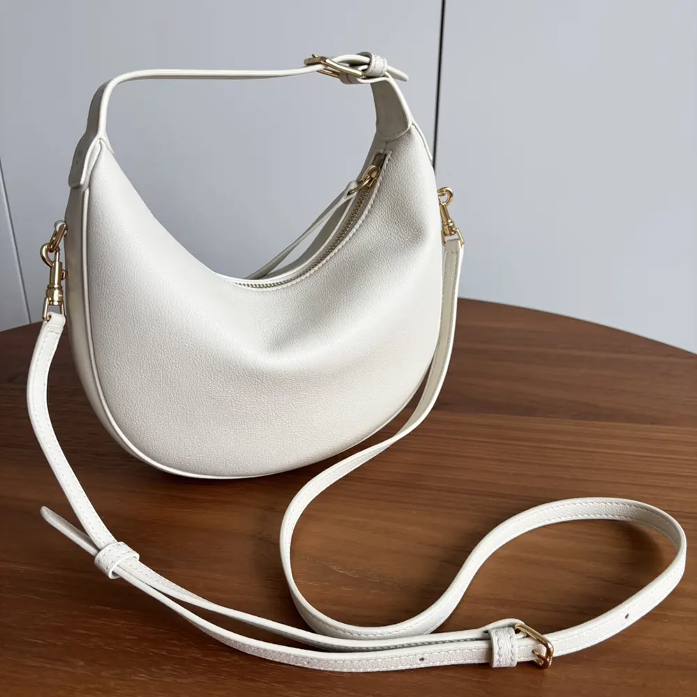 Side angle showing silhouette and adjustable strap of Celine Women Teen Celine Llulu