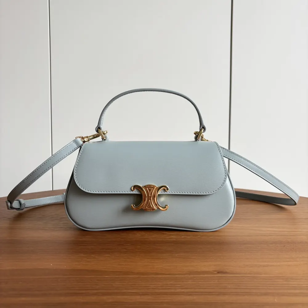Side view showing silhouette and flap closure of Celine Lola bag