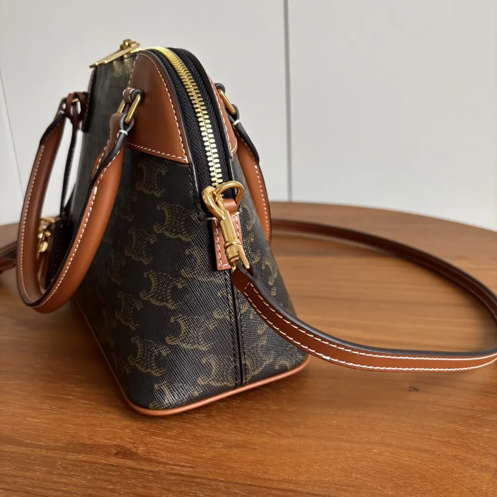 Side angle showing shoulder strap and structured silhouette of Celine Women Teen Honorine Bag