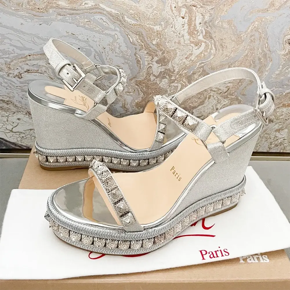 Close-up of studded Cataclou detail on silver leather espadrille heel