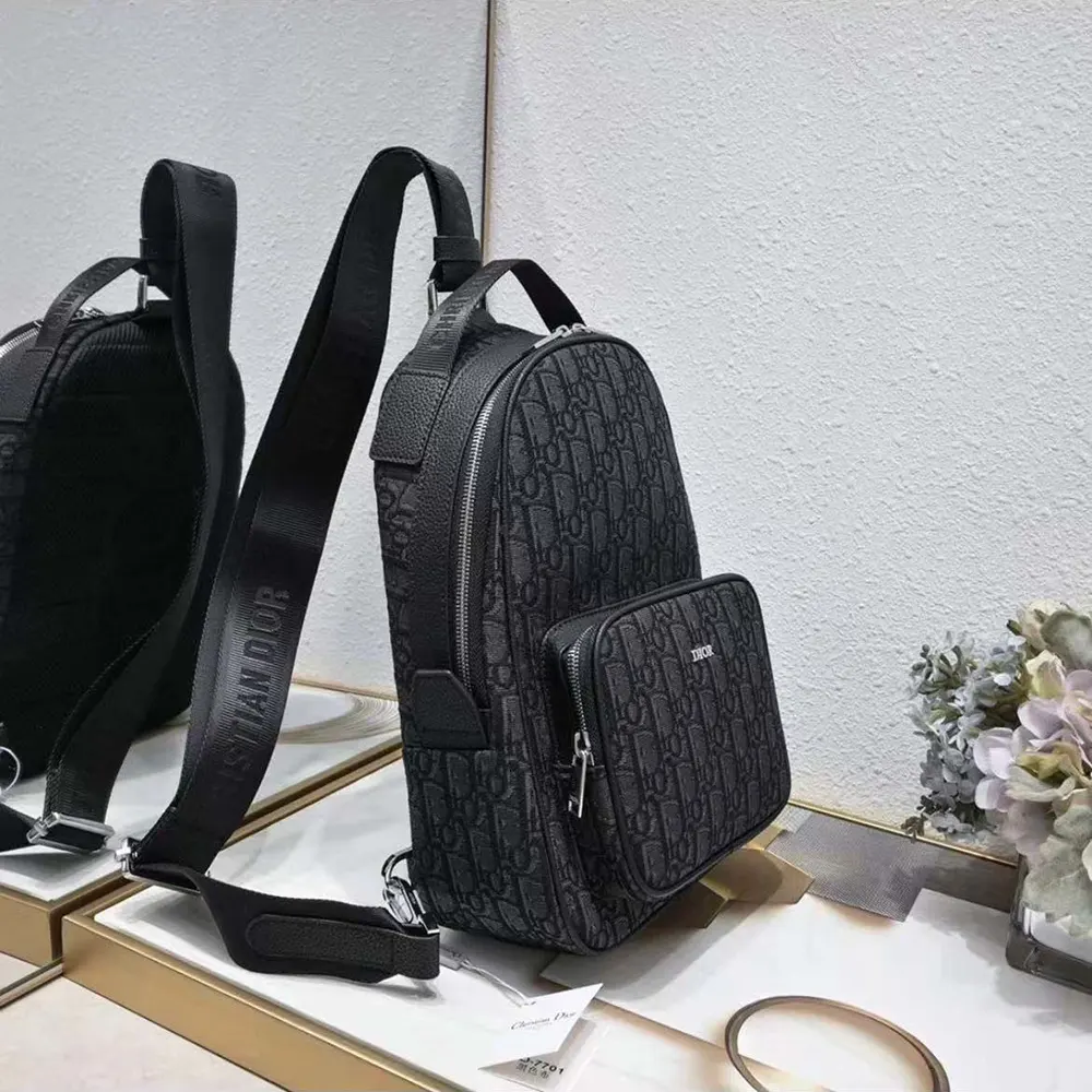 Side angle showing adjustable straps of Dior Men Mini Rider Backpack Black Dior Oblique Jacquard