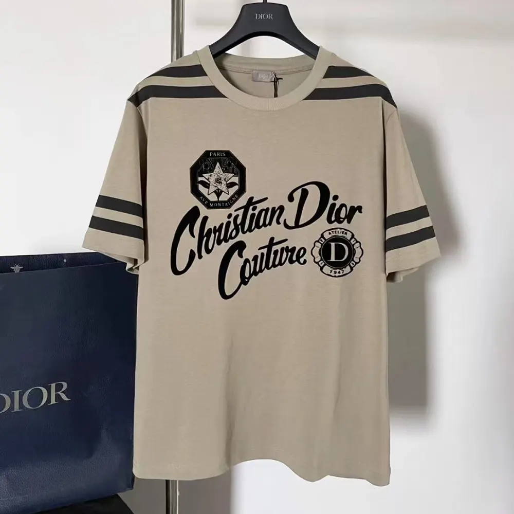 Close-up detail of Dior Couture logo on black cotton jersey t-shirt