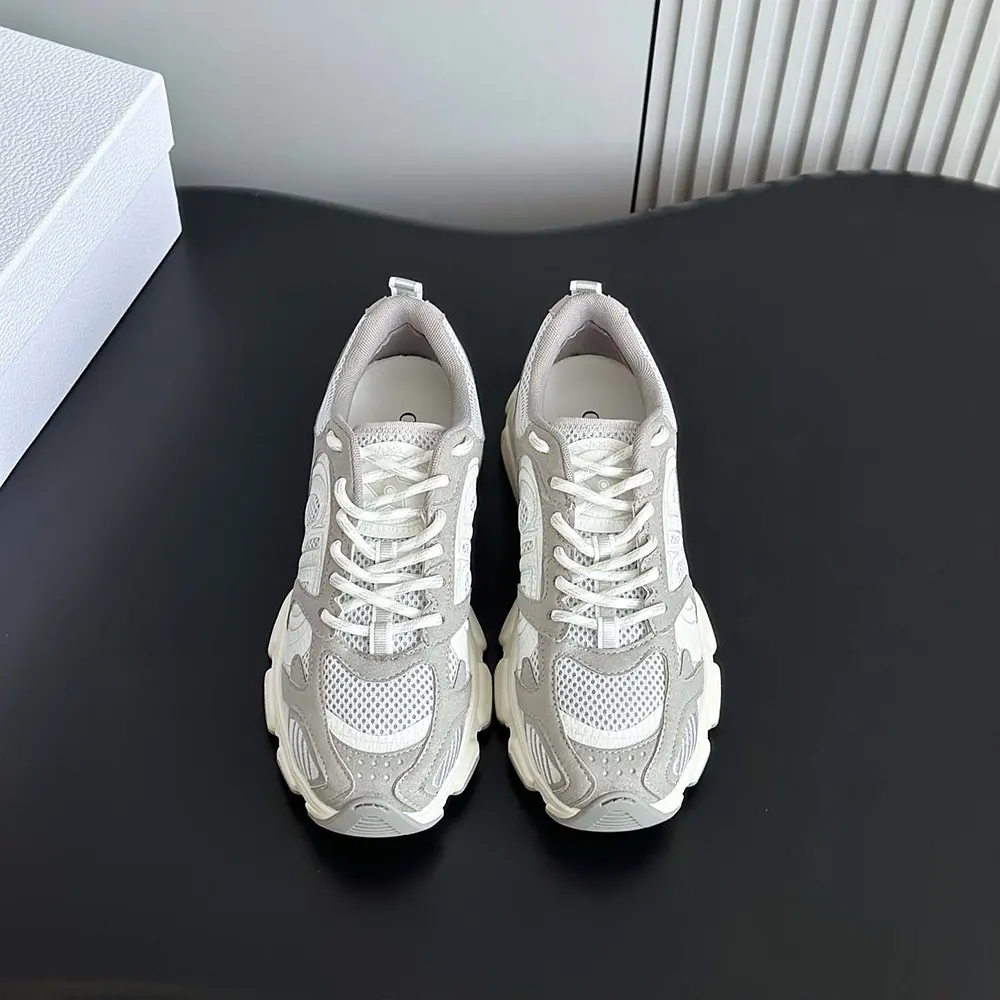 Close-up on Dior metal logo detail on Dior Unisex Chrono Sneaker