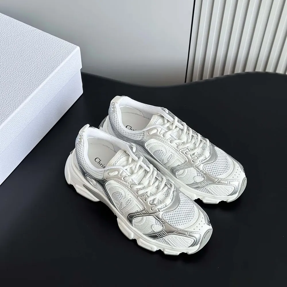 Side profile showcasing mesh and laminated leather of Dior Unisex Chrono Sneaker