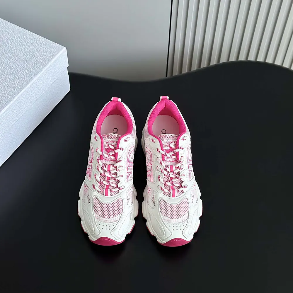 Close-up of pink leather-effect panels and silver Dior logo hardware on Chrono Sneaker