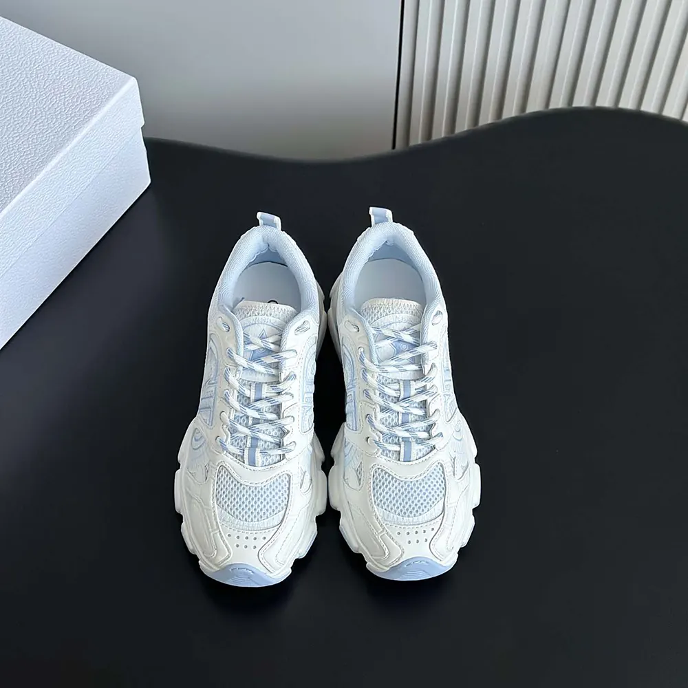 Close-up of the Dior Unisex Chrono Sneaker lace area and logo hardware
