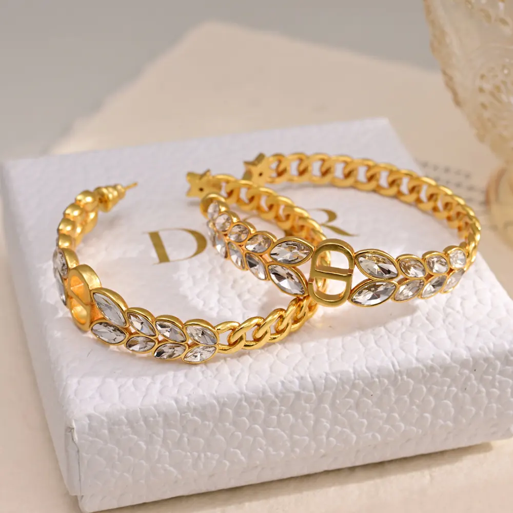 Close-up of silver-tone crystals on Dior Women 30 Montaigne Prestige Hoop Earrings