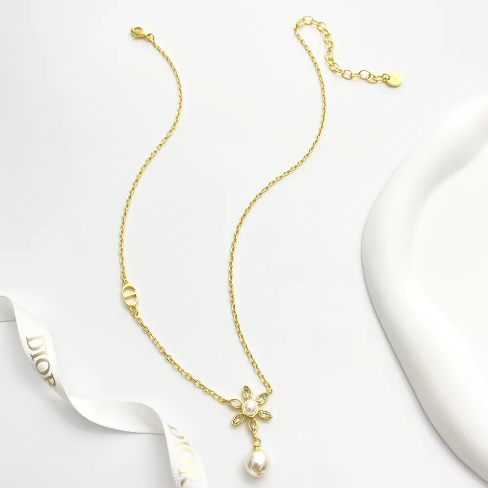 Close-up on white resin pearls and silver-tone crystals detail