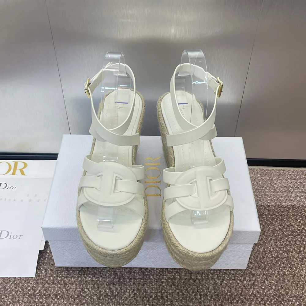 Close-up of white calfskin and embossed Dior logo detail
