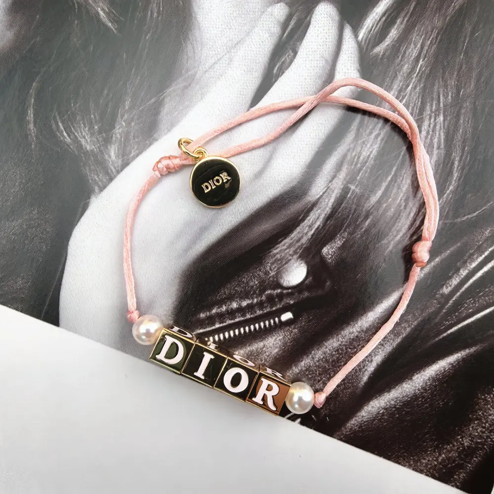 Dior Women D-Dice Bracelet worn on wrist with pearl and lacquer accents