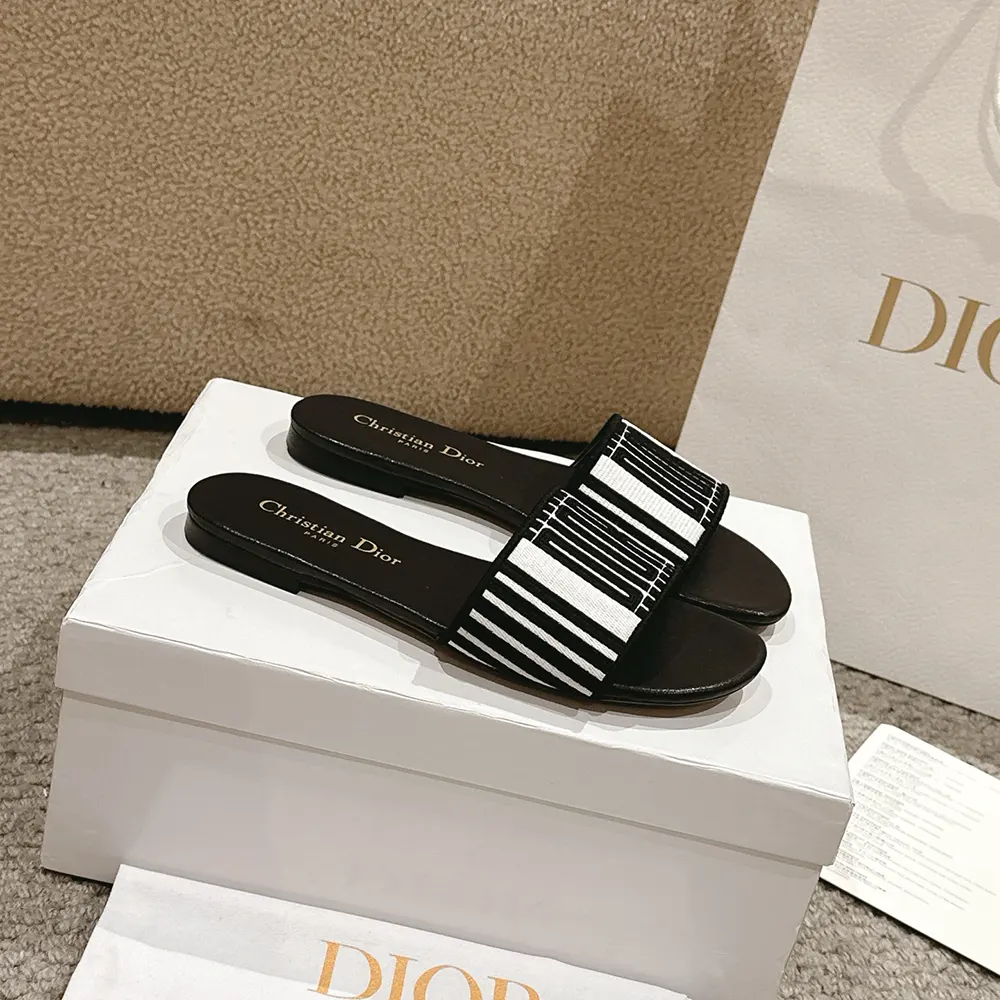 Side profile of Dior Women Dway Slide Black and White Cotton Embroidered sandal