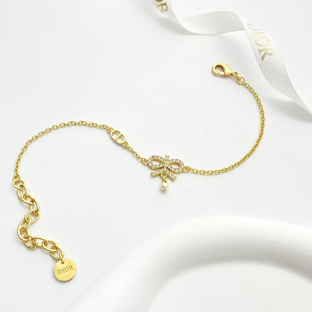 Side angle showing adjustable chain and clasp on Dior necklace