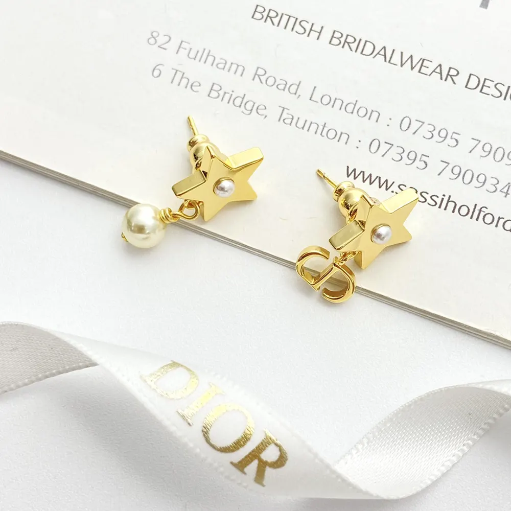 Side angle showing push-back closure on Dior Women Lucky Dior Earrings