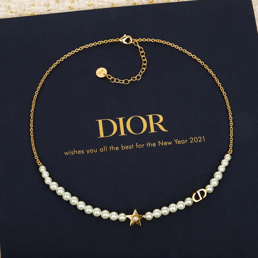 Styled image of Dior Women Lucky Dior Necklace worn on a model's neckline